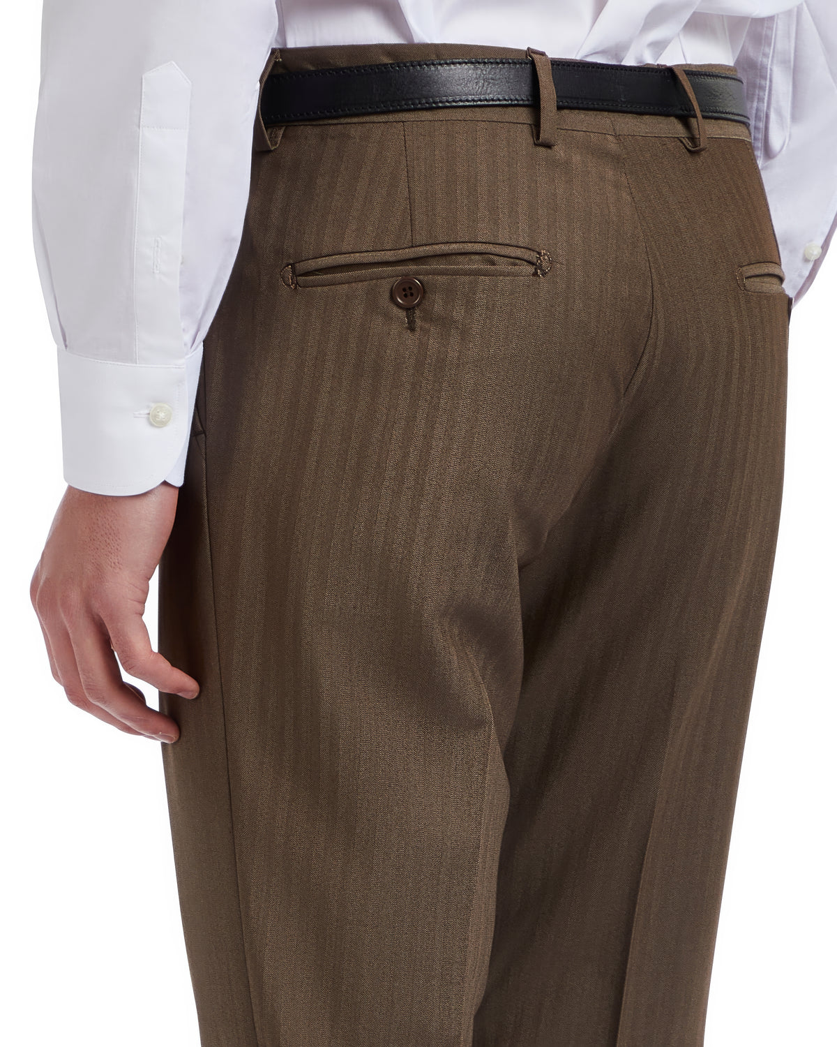 Men's tailored brown dress pants with a slim fit and subtle pinstripe, featuring back button pockets and a black leather belt.