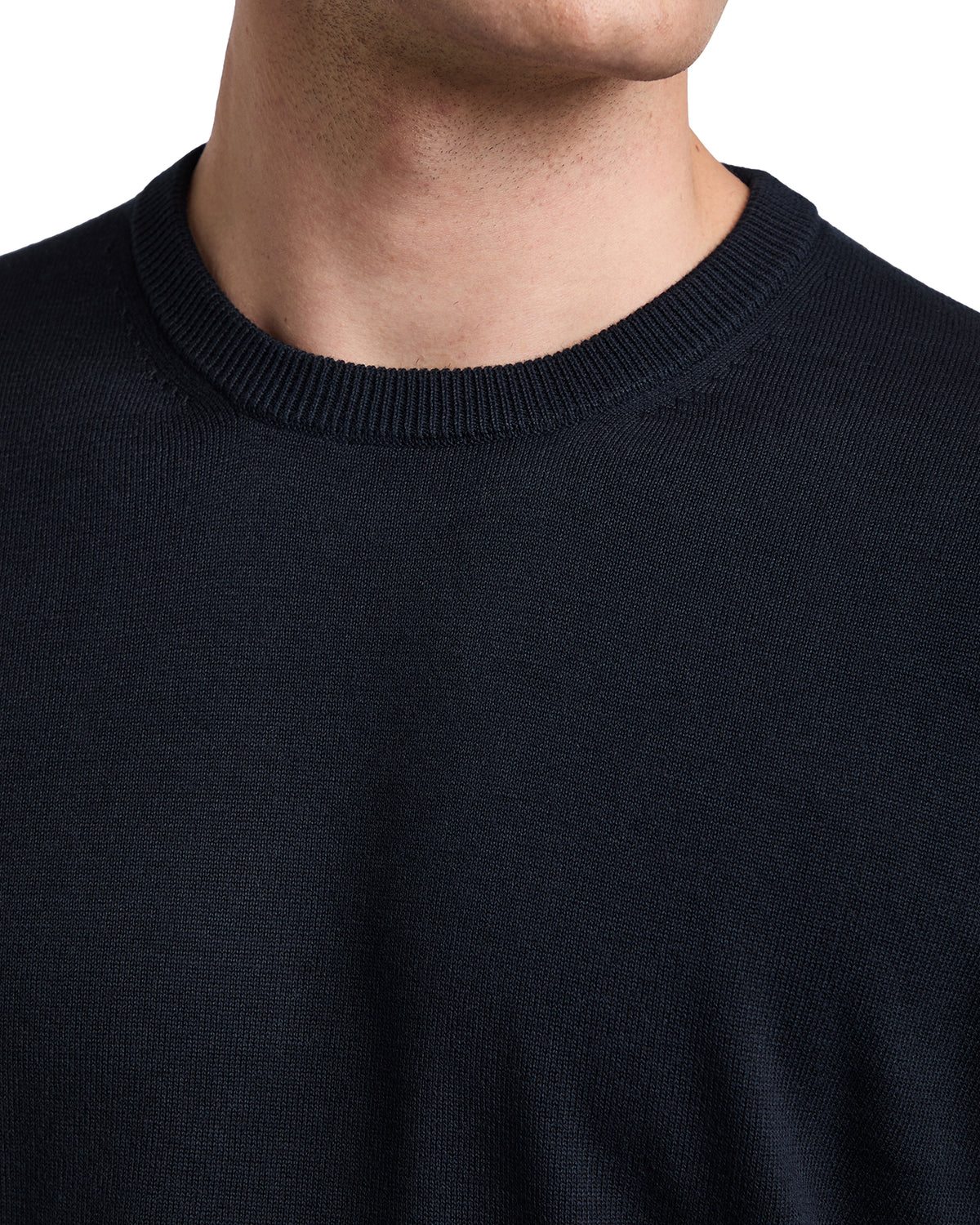 Navy blue knit crewneck sweater for men, made from soft, breathable fabric, perfect for casual or layering styles.