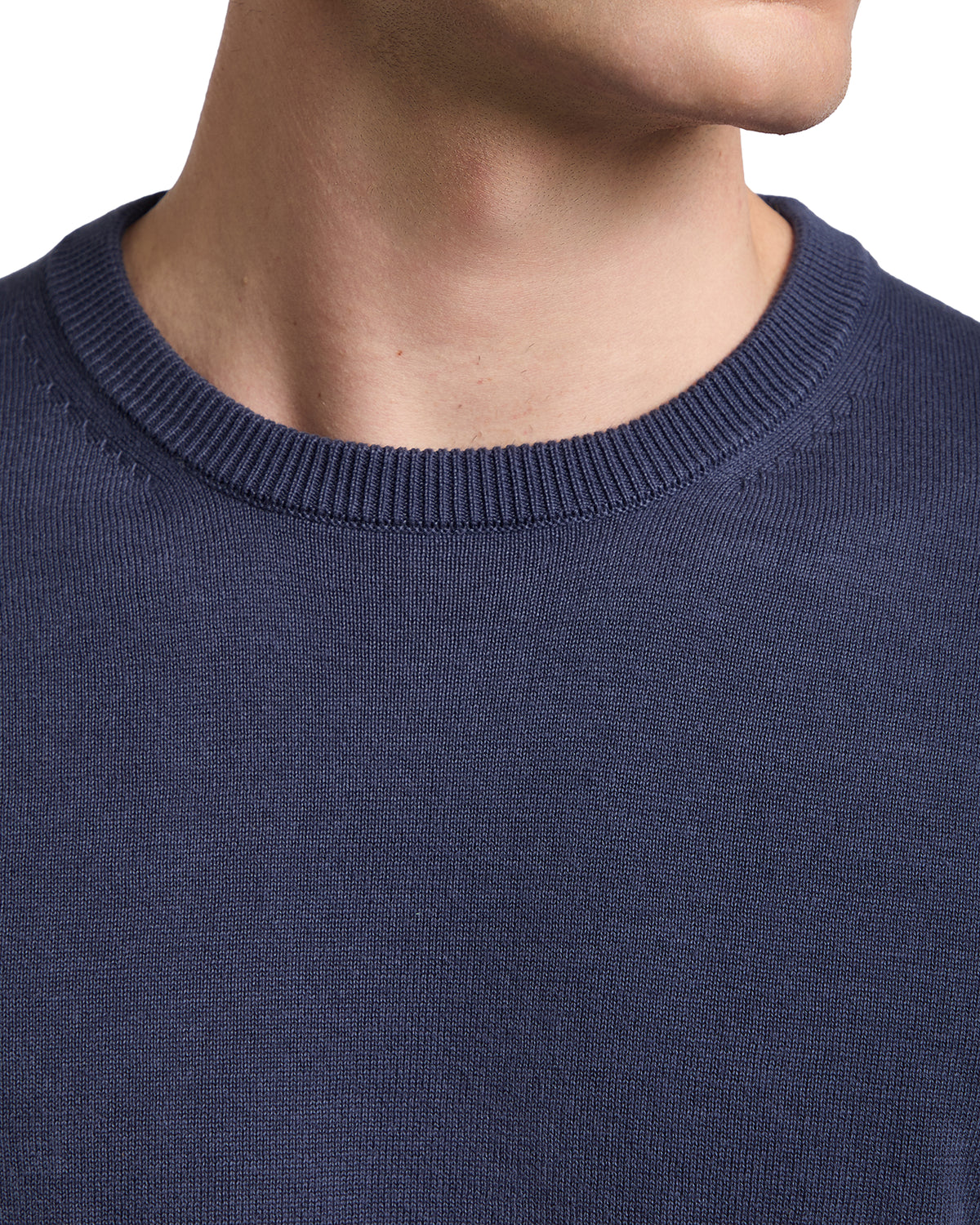Navy blue cotton sweater with a classic crew neckline, perfect for casual layering in cooler weather.