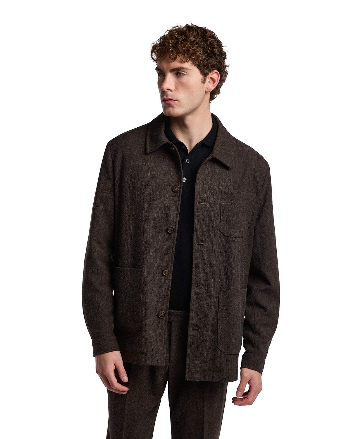 Brown wool blend jacket with a collared neckline and front pockets, styled with a black polo shirt.