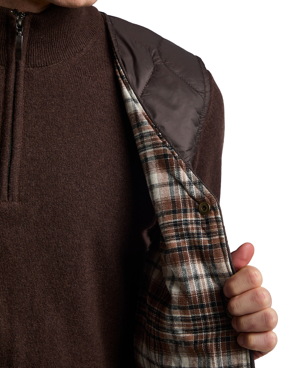 Brown knit pullover sweater with quilted brown vest lining and plaid flannel interior, perfect for casual layering.
