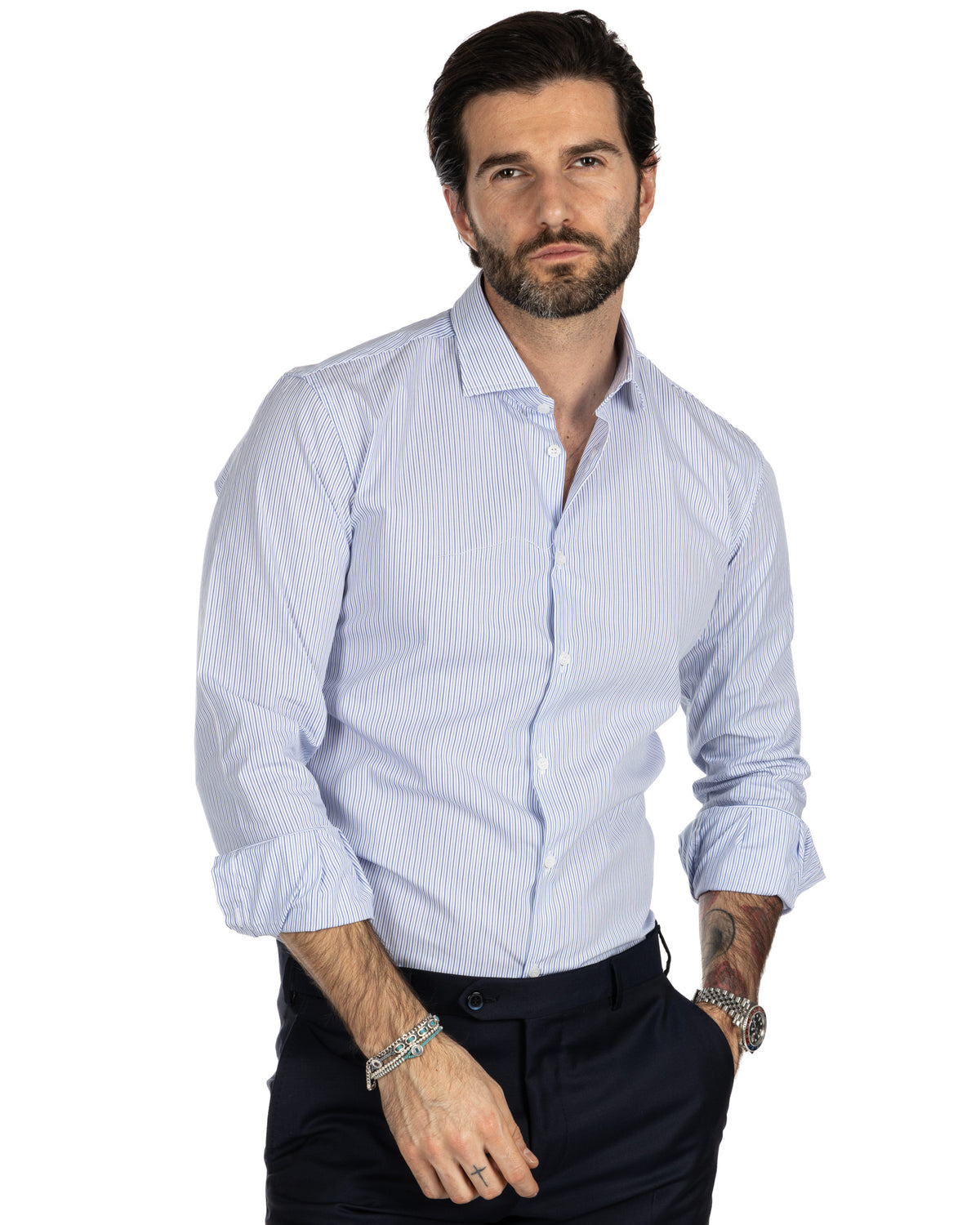 Men's light blue striped cotton dress shirt with spread collar, button front, and rolled sleeves.