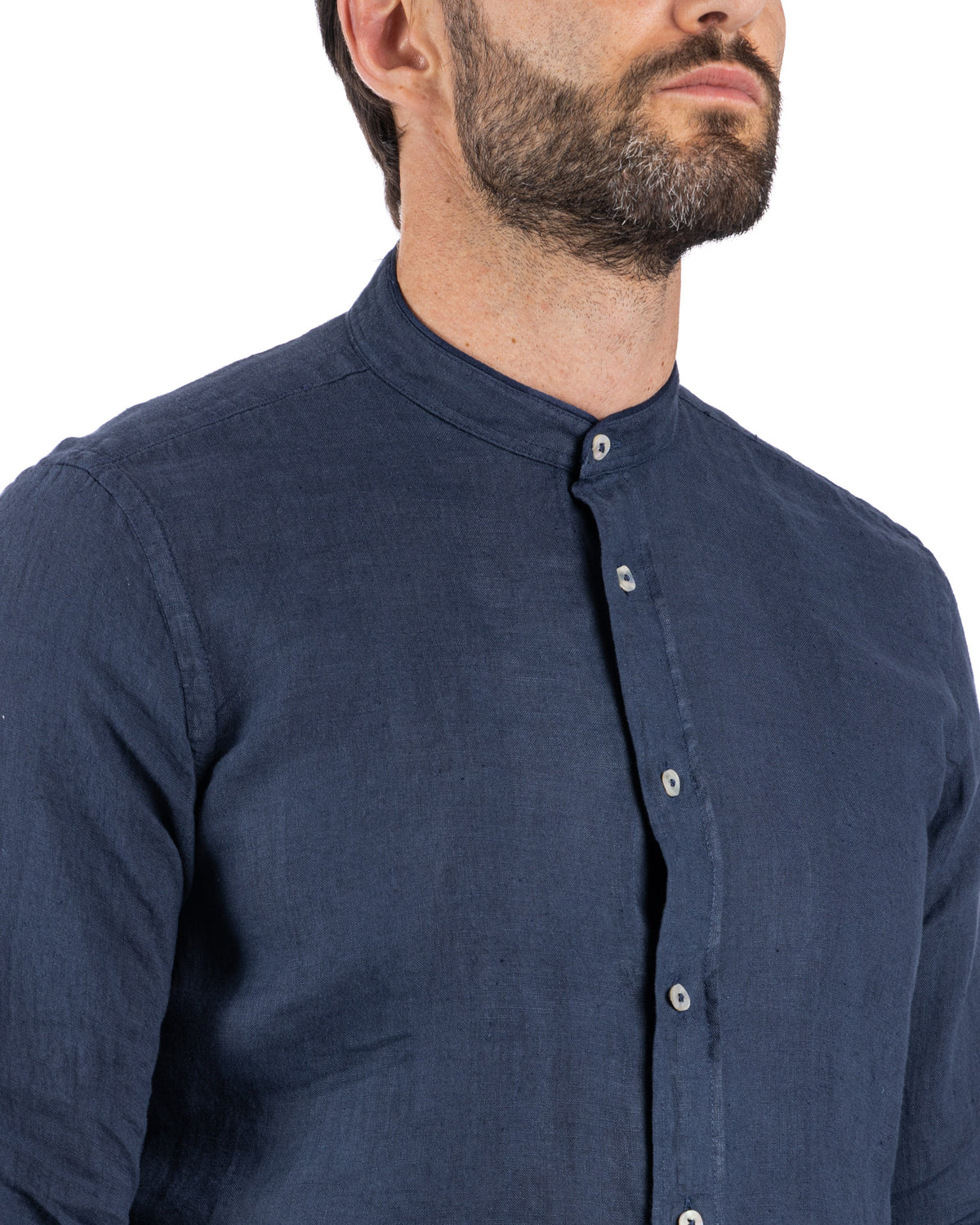 Navy blue linen men's banded collar shirt with white buttons, long sleeves, and relaxed fit.
