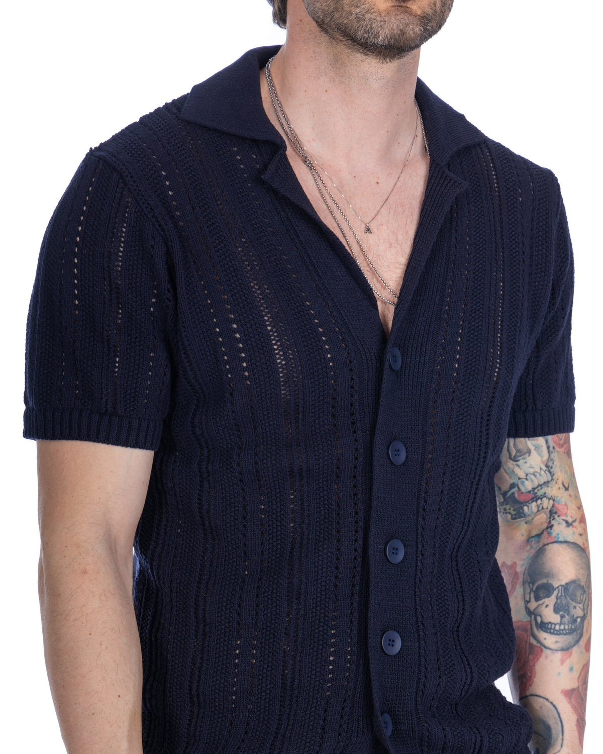 Navy blue short sleeve knit cardigan with openwork pattern, button front, and polo collar. Lightweight cotton blend.