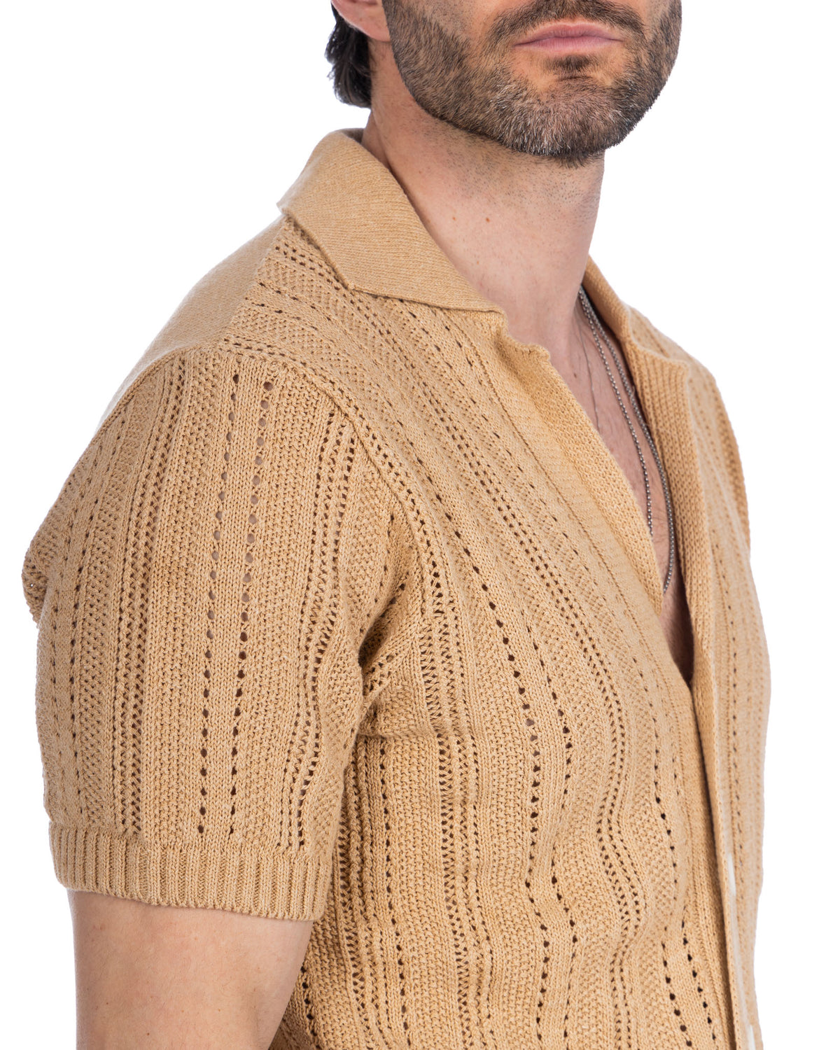 Beige short sleeve knit cardigan with openwork pattern, polo collar, and button front. Lightweight summer sweater.
