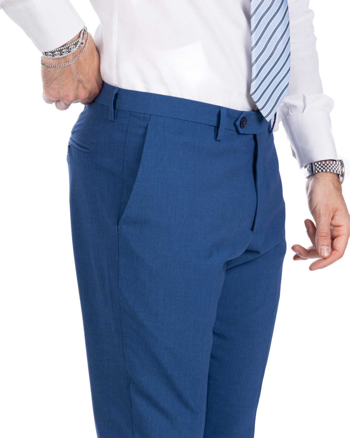 Royal blue slim-fit dress pants with pleated front, tailored waist, and formal business style for men's suits.