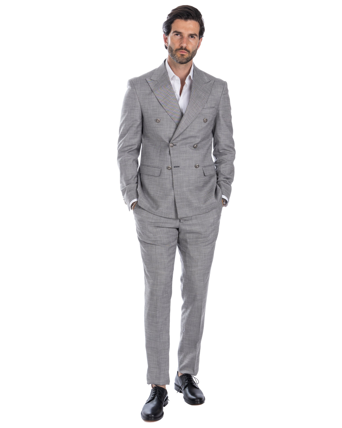 Light gray double-breasted wool suit with peak lapels, white dress shirt, and black leather oxford shoes.