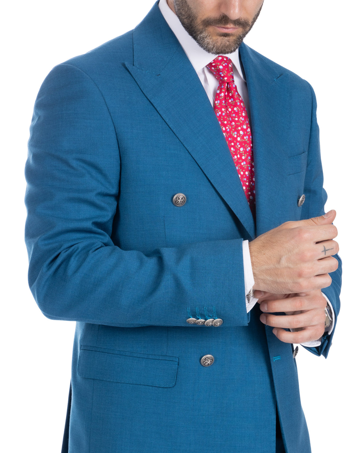 Teal blue double-breasted wool suit jacket with silver buttons, red floral tie, and white dress shirt.