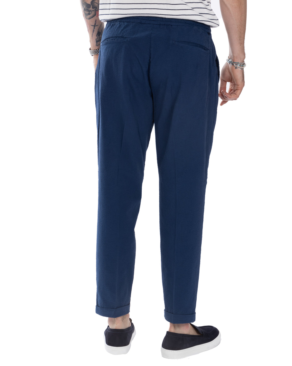 Navy blue seersucker men's relaxed-fit trousers with elastic waist, back pockets, and cuffed ankles. Casual summer pants.