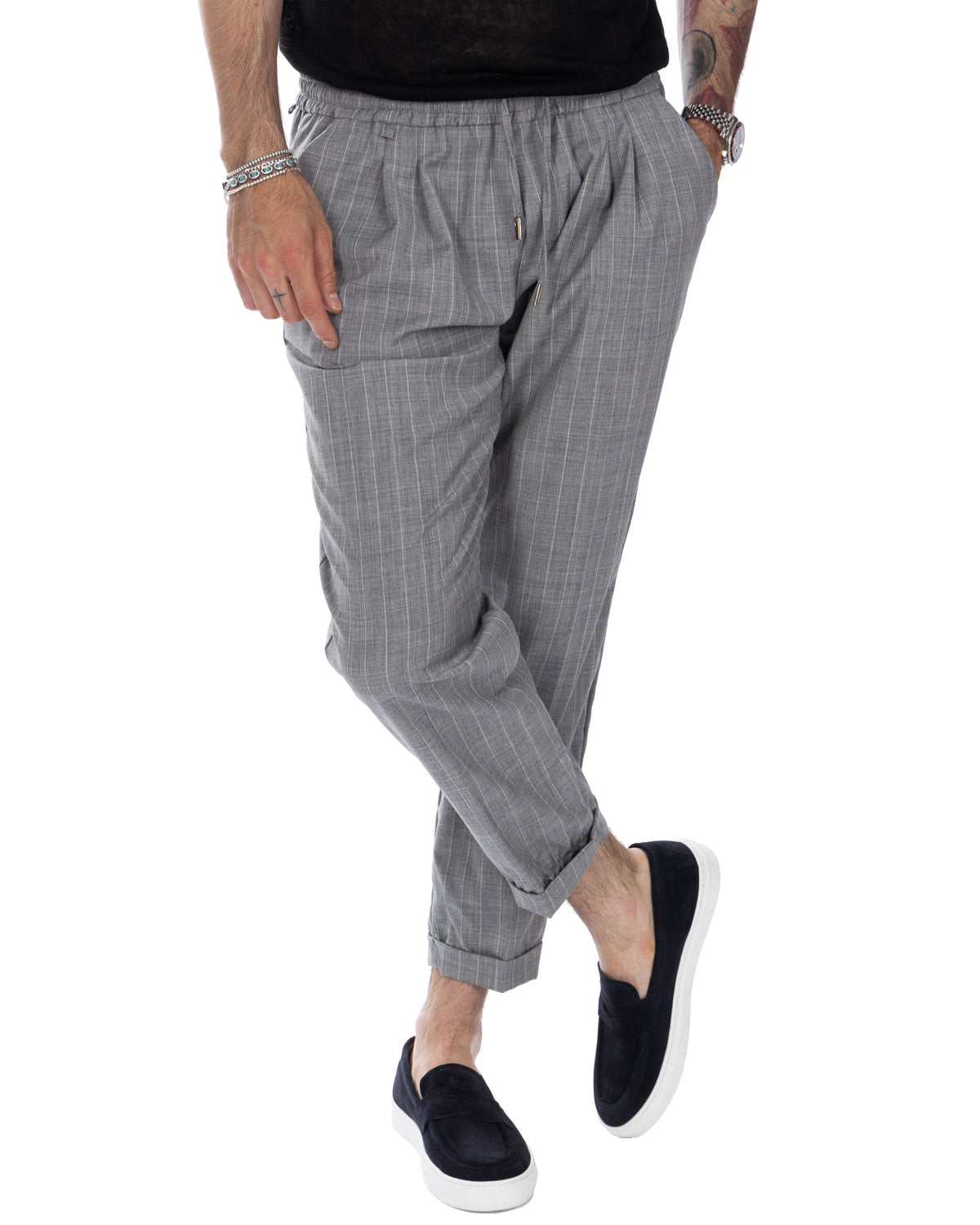 Men's gray pinstripe drawstring joggers with elastic waist, cuffed ankles, and side pockets. Casual tailored fit trousers.