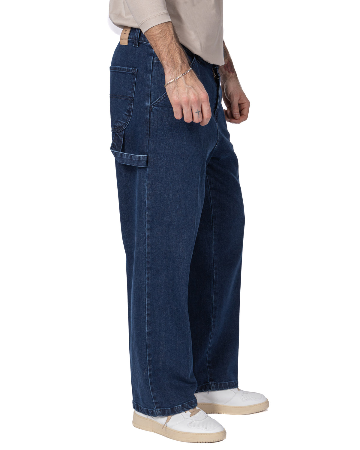 Men's dark blue denim carpenter jeans with side utility pocket, relaxed fit, and straight leg style