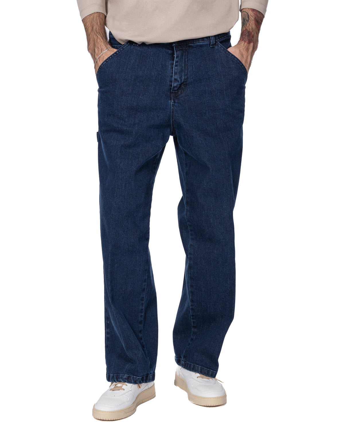 Men's dark blue denim carpenter jeans with relaxed fit, side pockets, and straight leg style.
