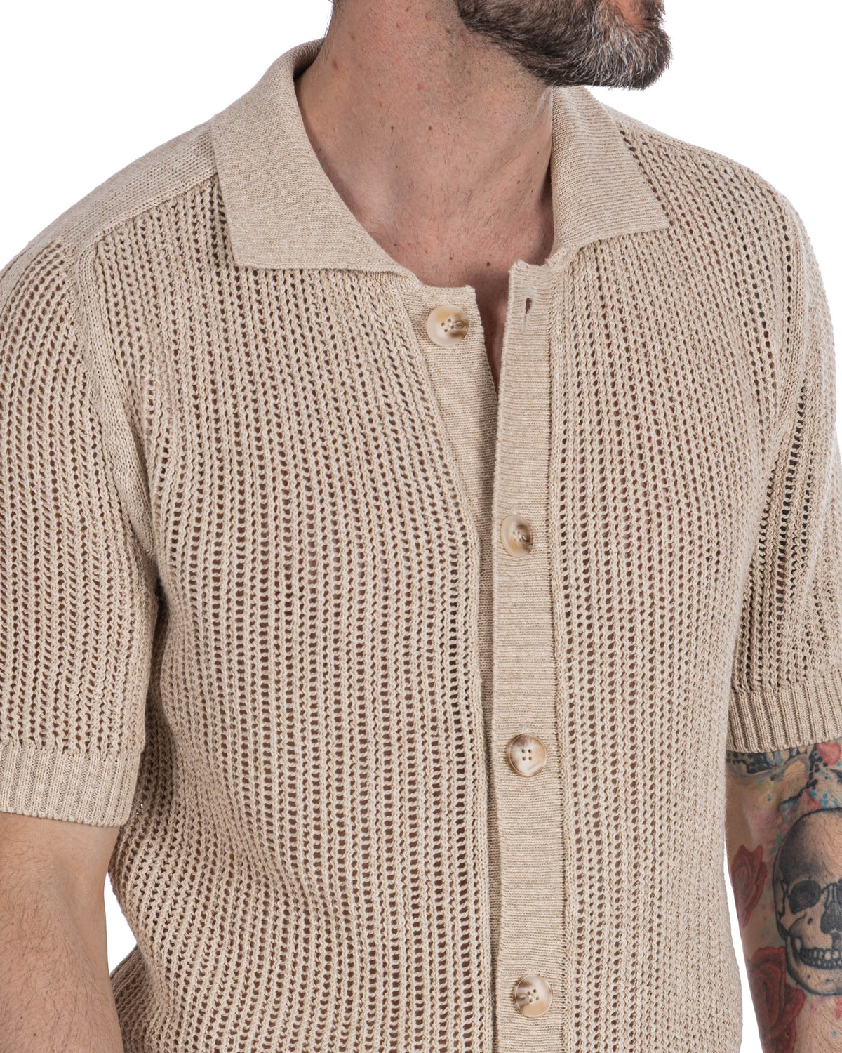 Beige linen short sleeve knit cardigan with open weave texture, button front, and polo collar.