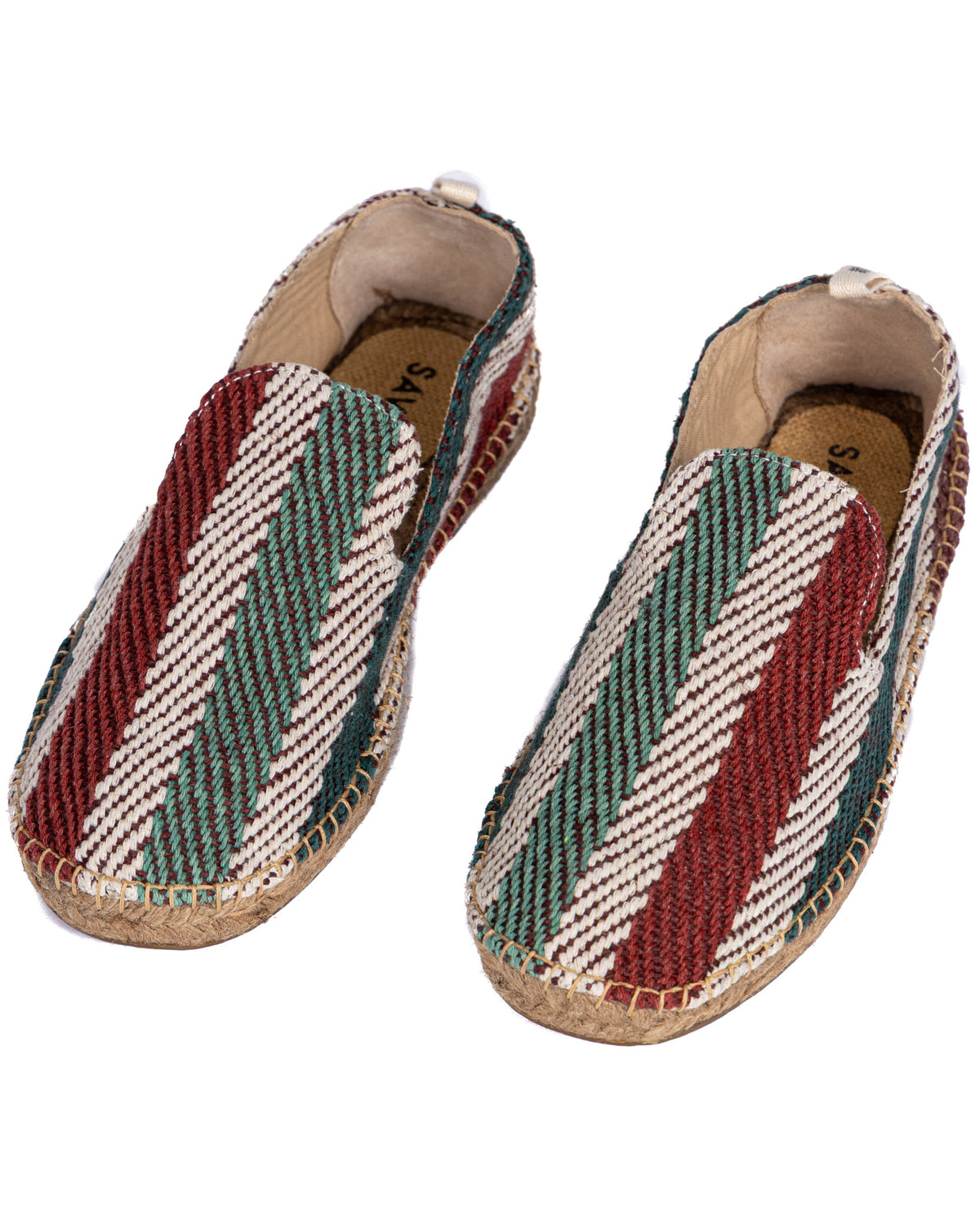Colorful woven espadrille slip-ons with red, green, and white geometric pattern, jute soles, and canvas lining.