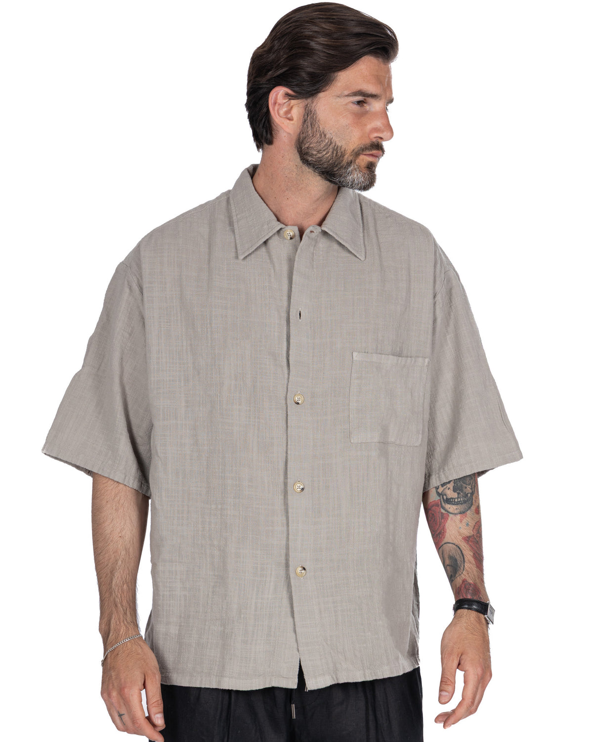 Men's light gray short sleeve linen button-up shirt with relaxed fit, chest pocket, and camp collar.