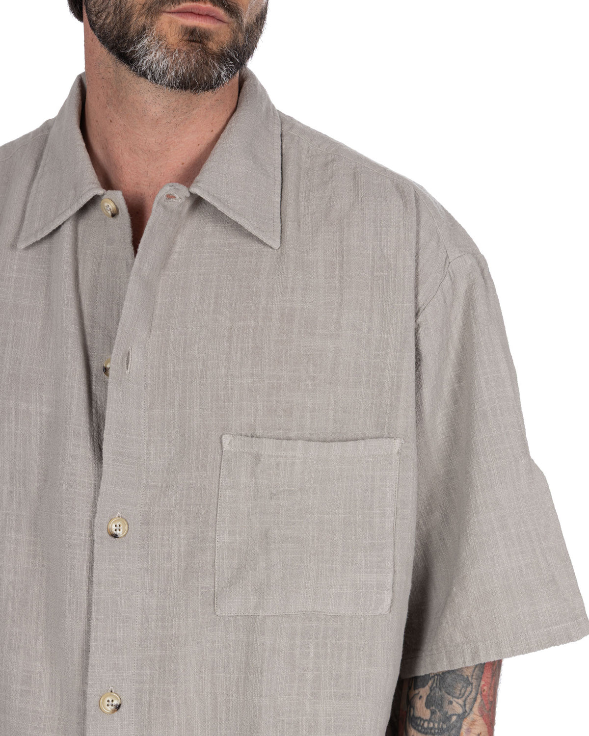 Light gray linen short sleeve button-up shirt with chest pocket and camp collar, relaxed fit summer style