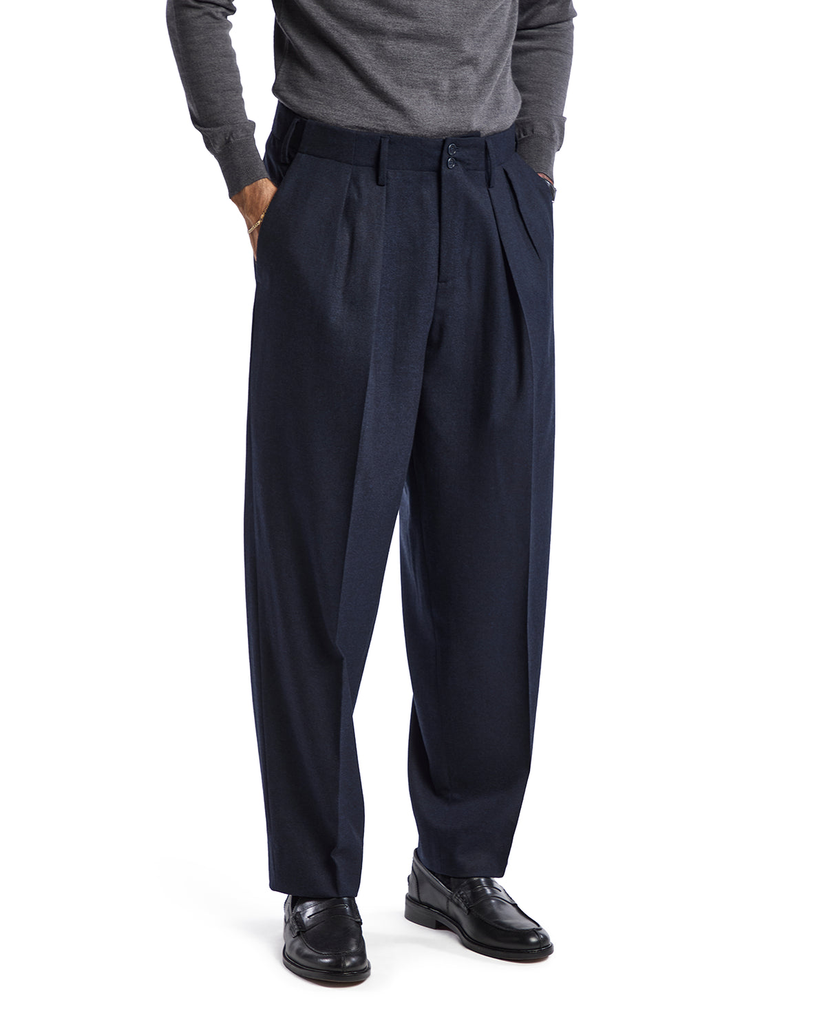 Navy blue wool pleated trousers for men, featuring a relaxed fit and side pockets, perfect for formal or casual wear.