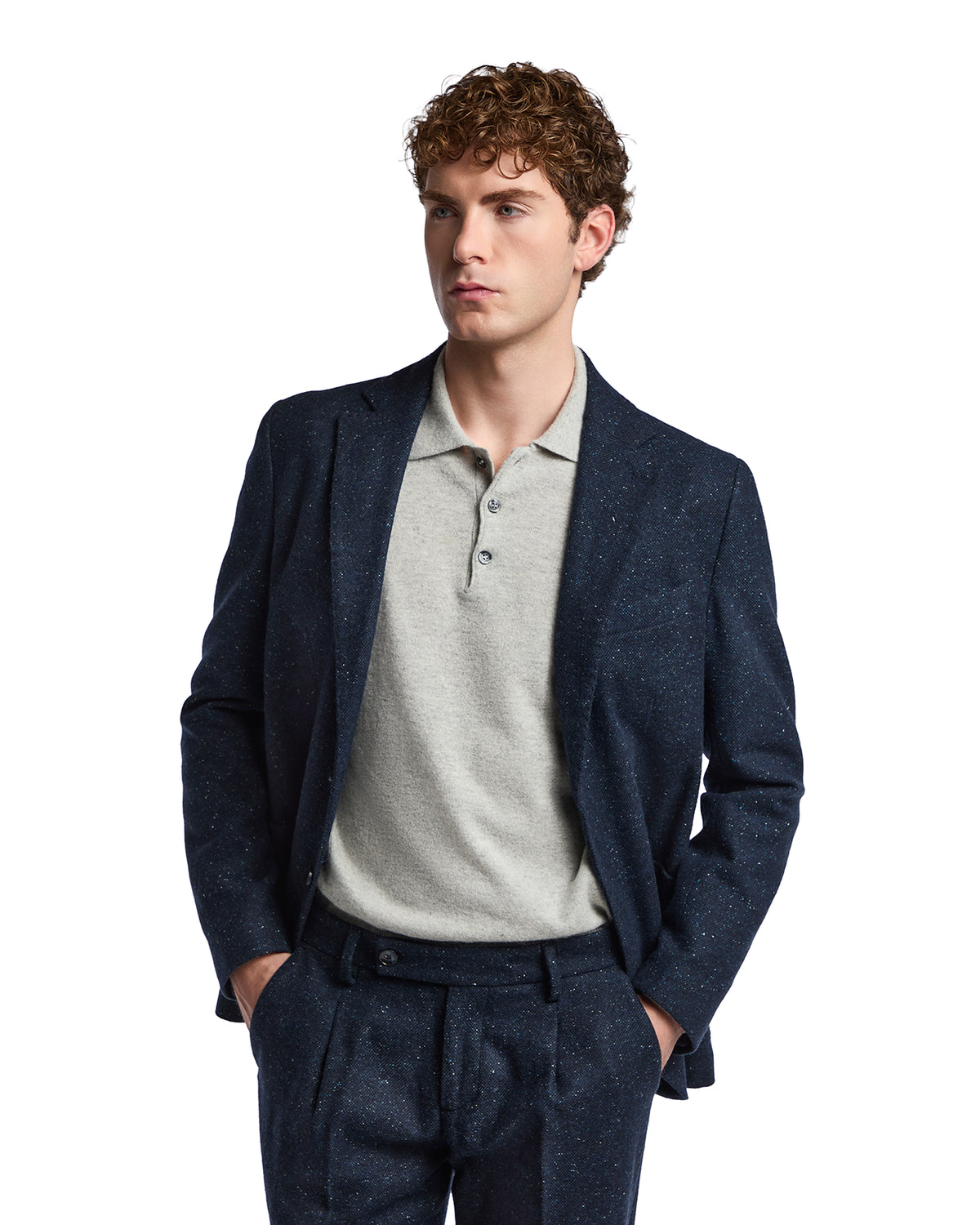 Navy speckled blazer with gray polo shirt, tailored fit, perfect for smart-casual occasions.