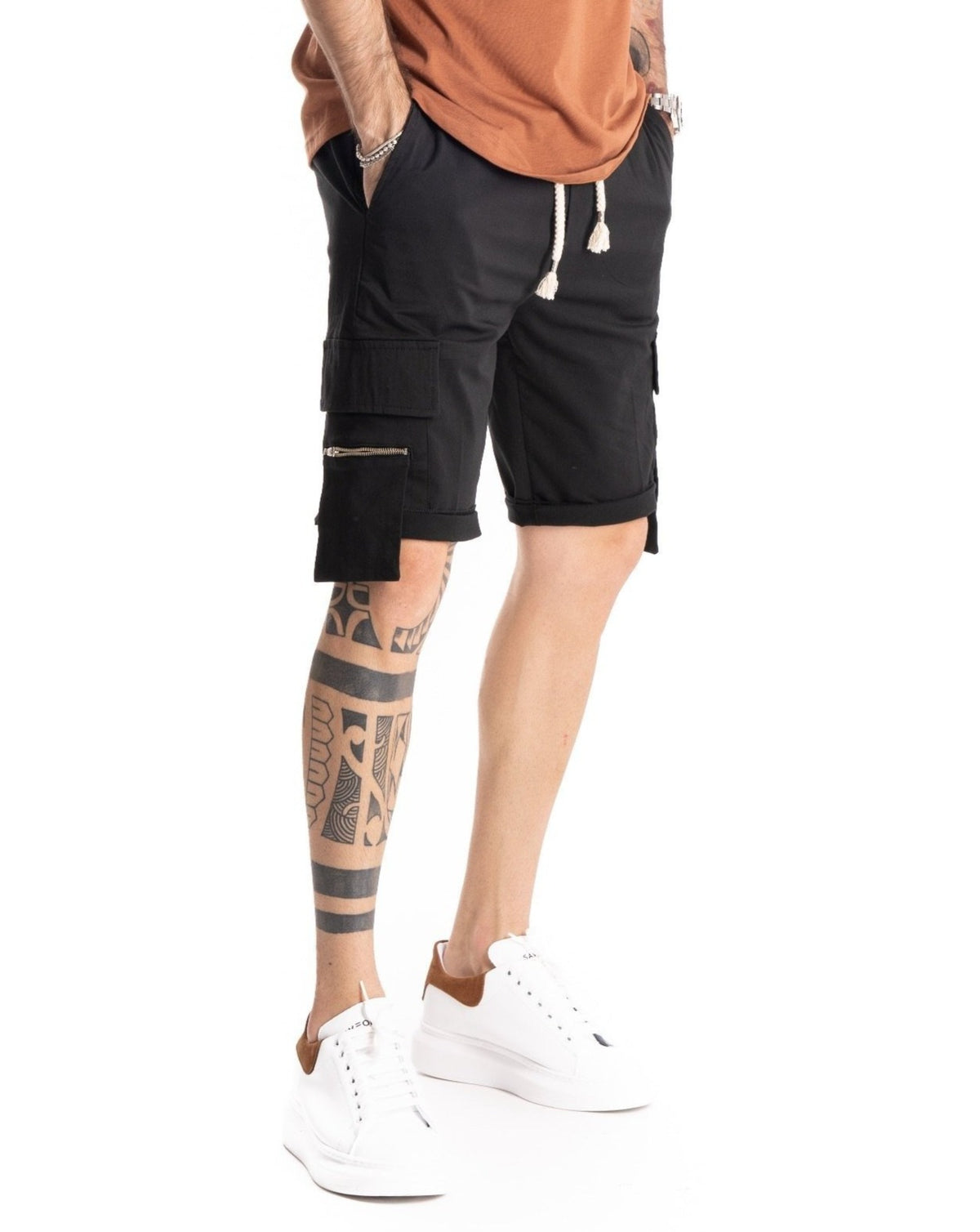 Black cargo shorts with zip pockets and rolled cuffs, shown in side profile