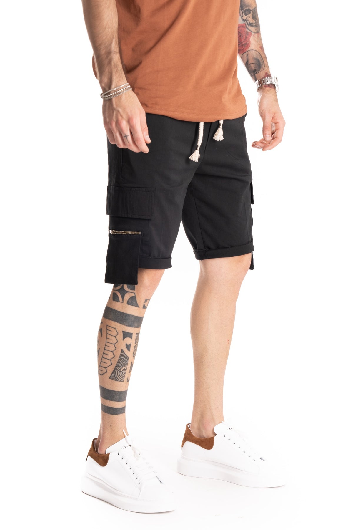Black cargo shorts with zip pockets and cuffed hems, shown in side profile