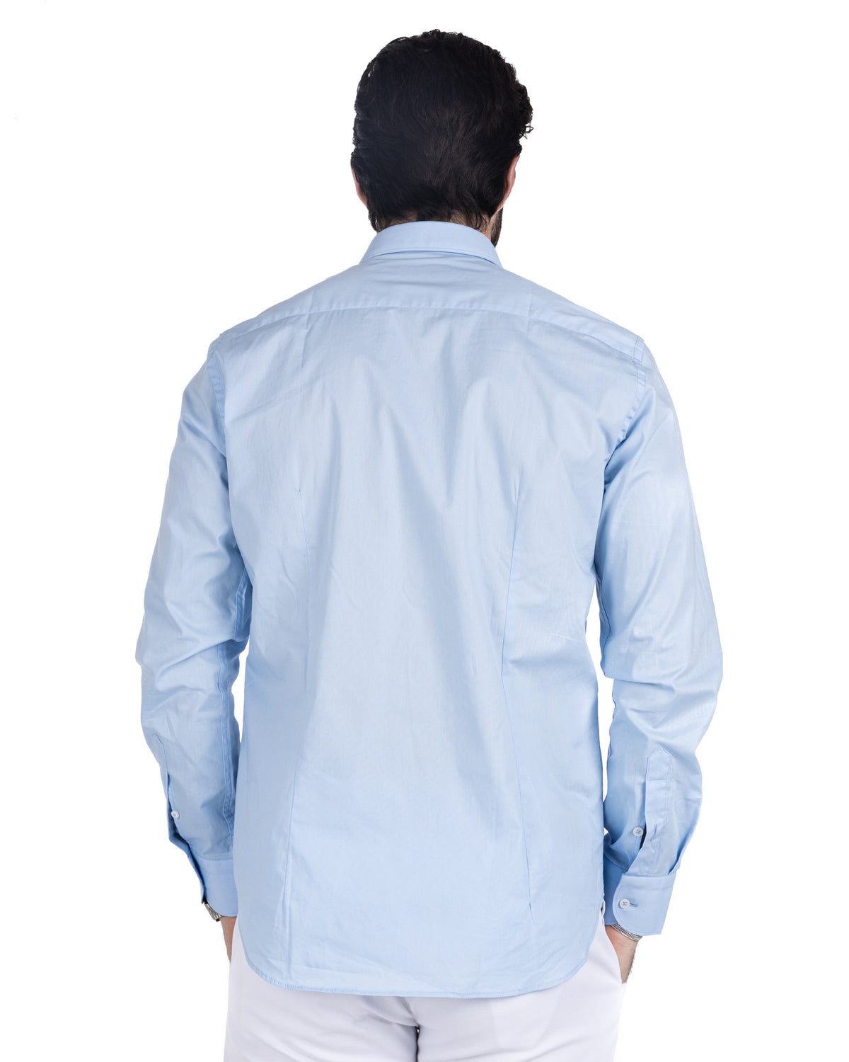 Back view of men's light blue cotton shirt with center back seam and buttoned barrel cuffs