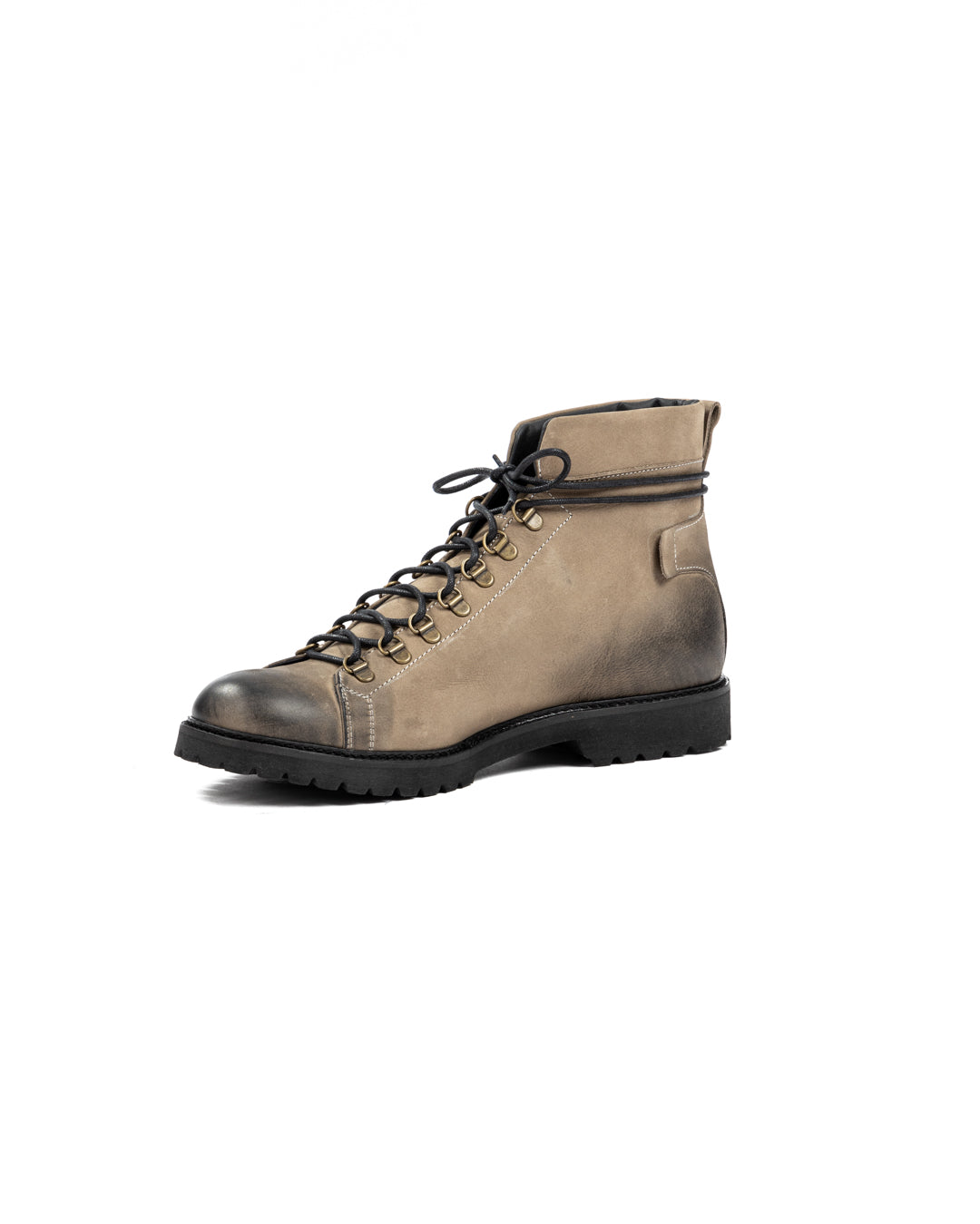 Taupe nubuck leather hiking boot with black rubber sole, brass eyelets, and lace-up ankle design.
