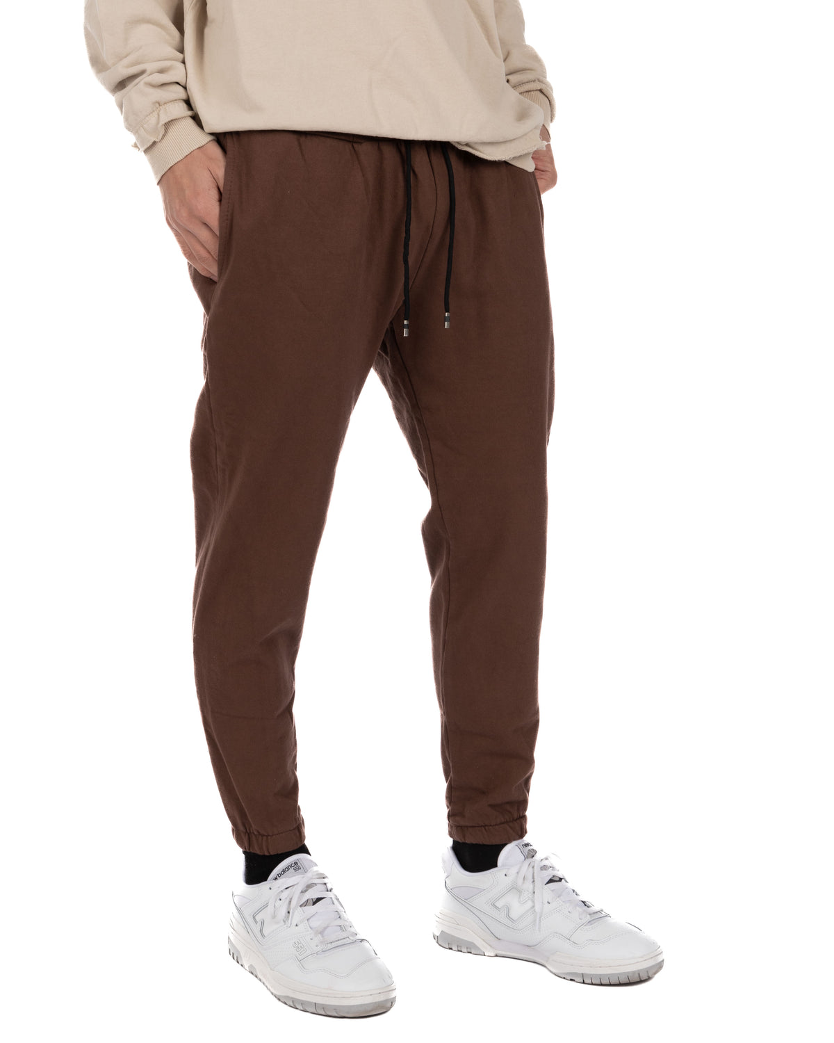 Men's brown cotton joggers with drawstring waist, elastic cuffs, and side pockets. Casual athletic sweatpants.