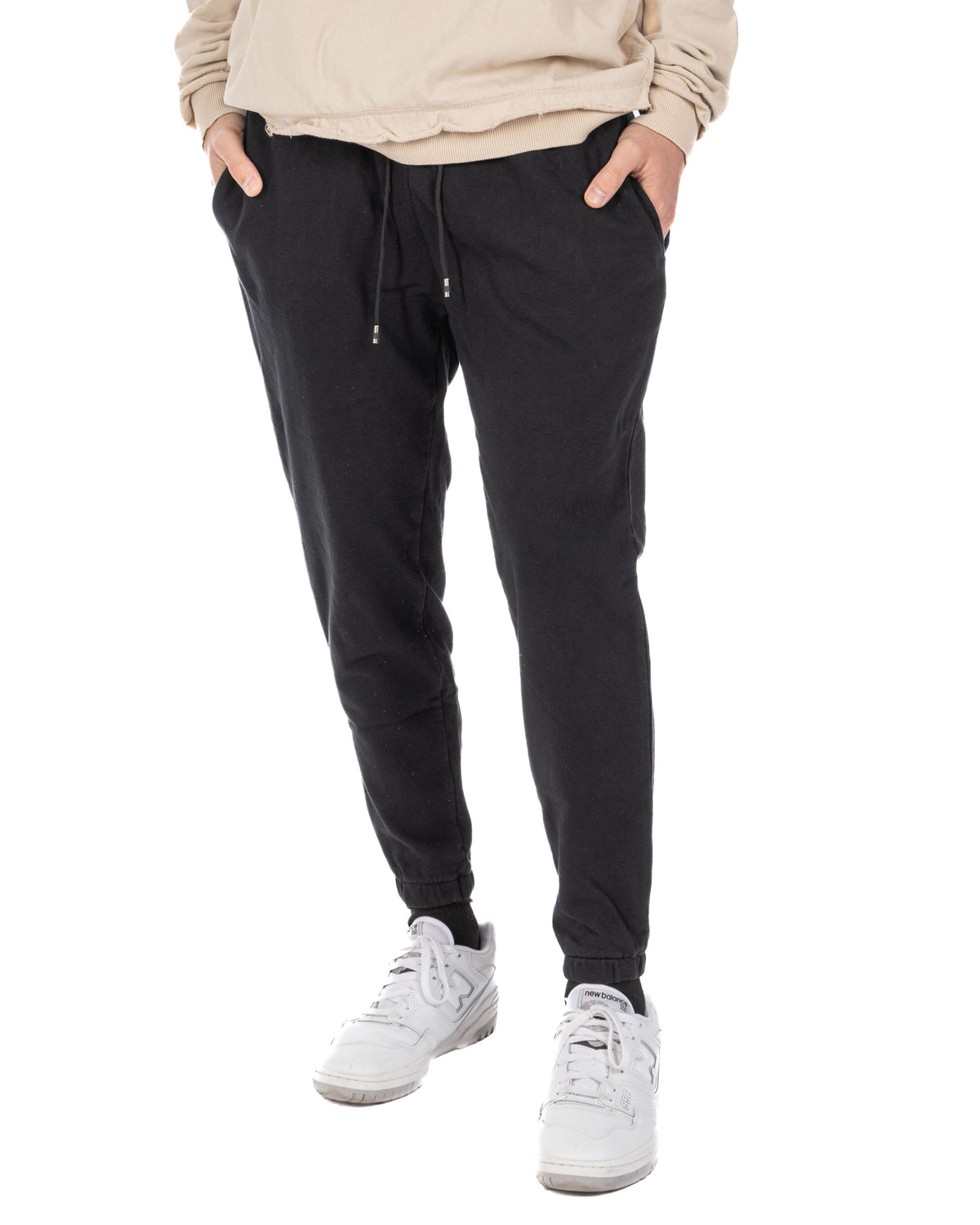 Black cotton joggers with drawstring waist, cuffed ankles, and side pockets. Casual athletic style sweatpants.