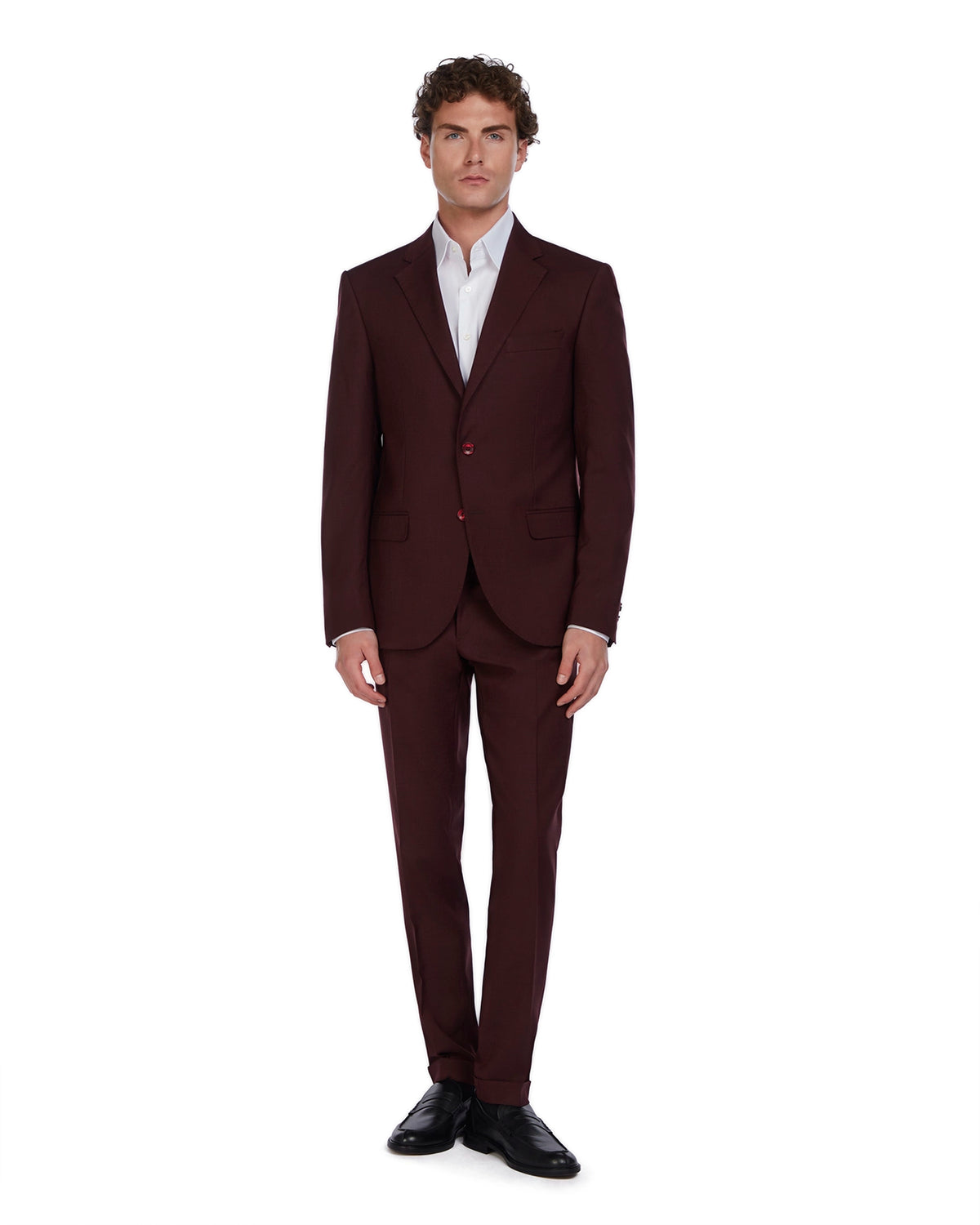 Men's burgundy tailored suit with a modern fit, featuring two buttons and sharp lapels, paired with a crisp white shirt.