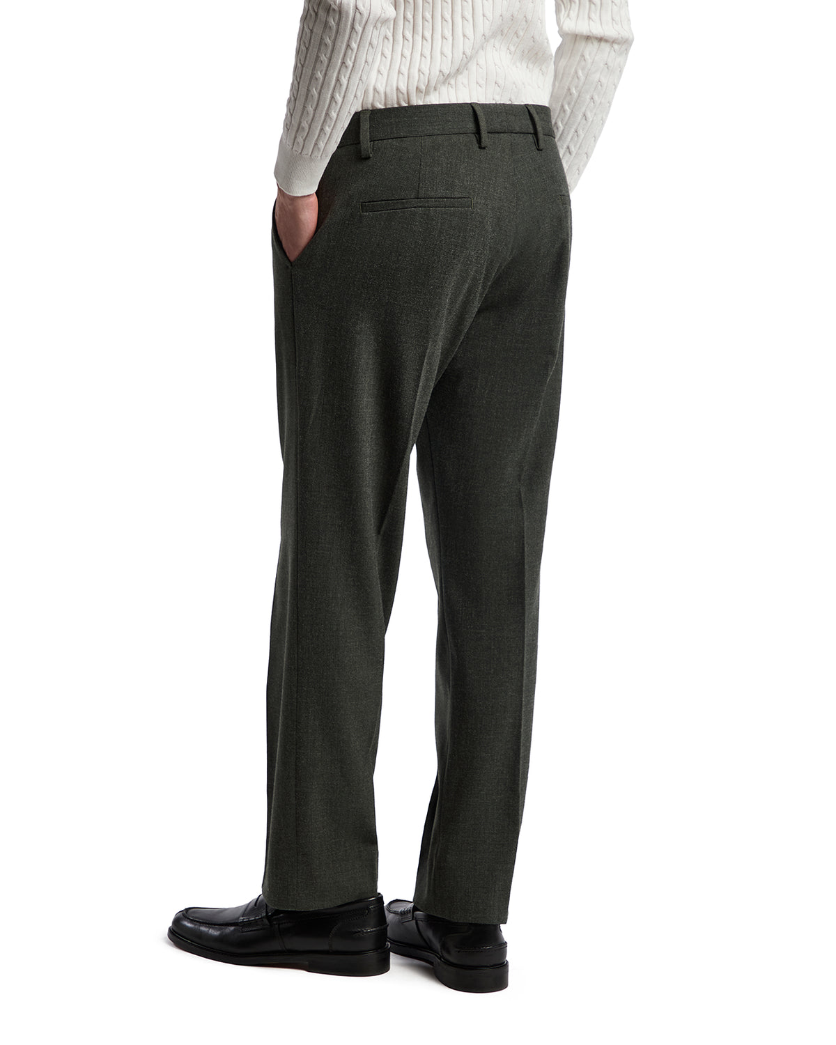 Men's dark green wool blend trousers with a tailored fit, featuring a classic back pocket and sleek black shoes.