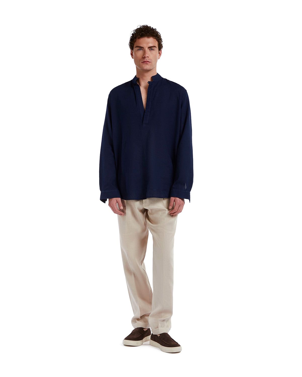 Navy linen long sleeve shirt paired with beige trousers, casual style for men.