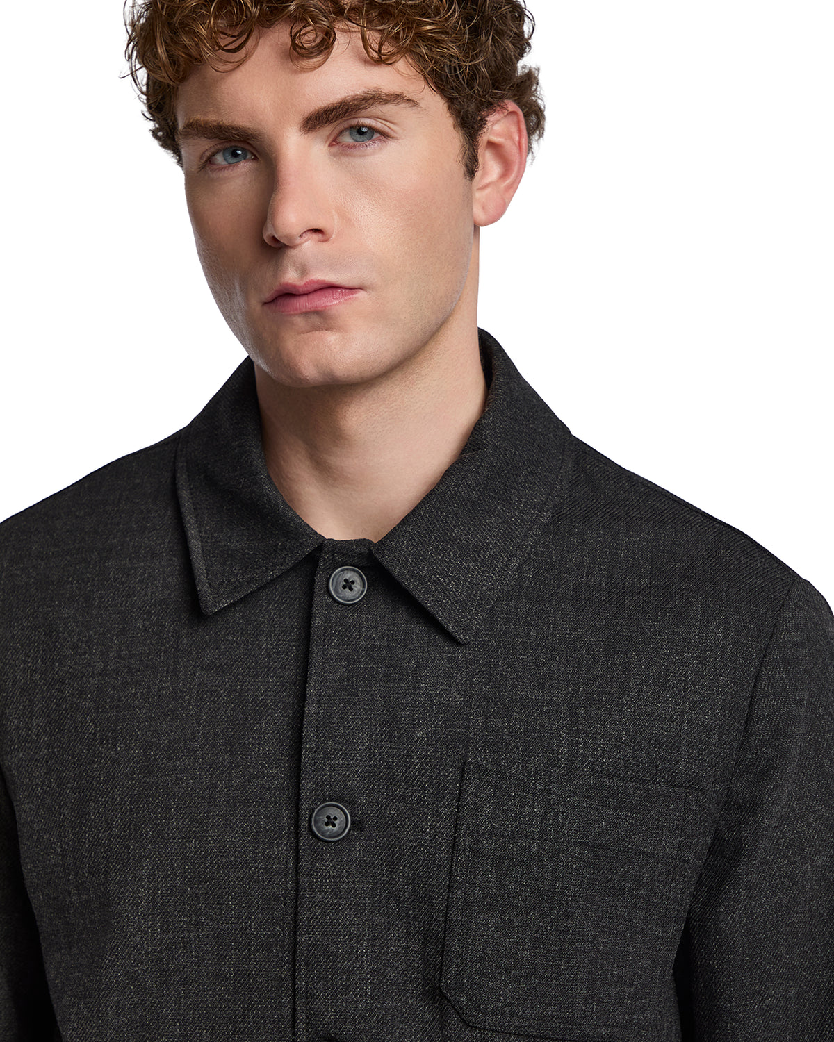 Men's black wool blend shirt jacket with a collar and button closure, featuring a chest pocket. Stylish and modern.