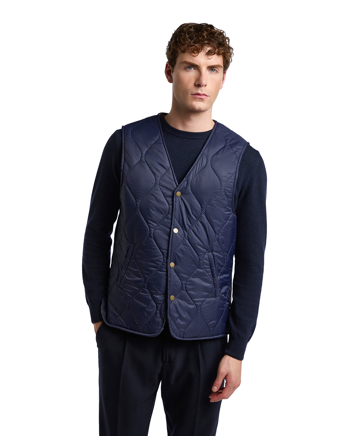 Men's navy quilted vest, featuring a button-front design and soft, lightweight material for stylish warmth.
