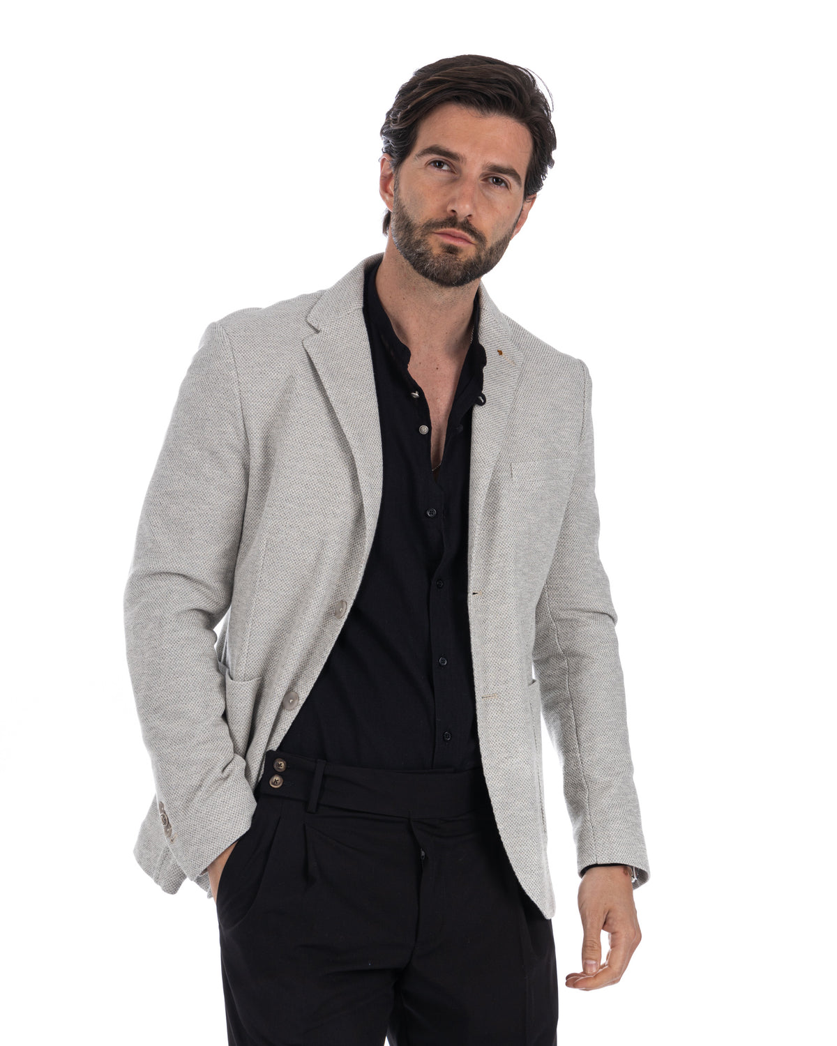 Light gray textured linen blazer with black button-down shirt and black trousers, smart casual men's fashion.