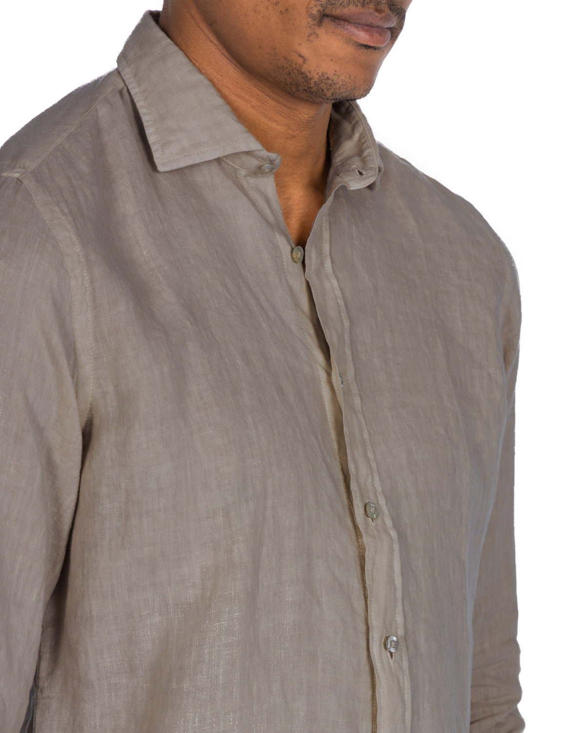 Men's beige linen button-down shirt with relaxed collar and long sleeves. Lightweight, breathable fabric for casual style.