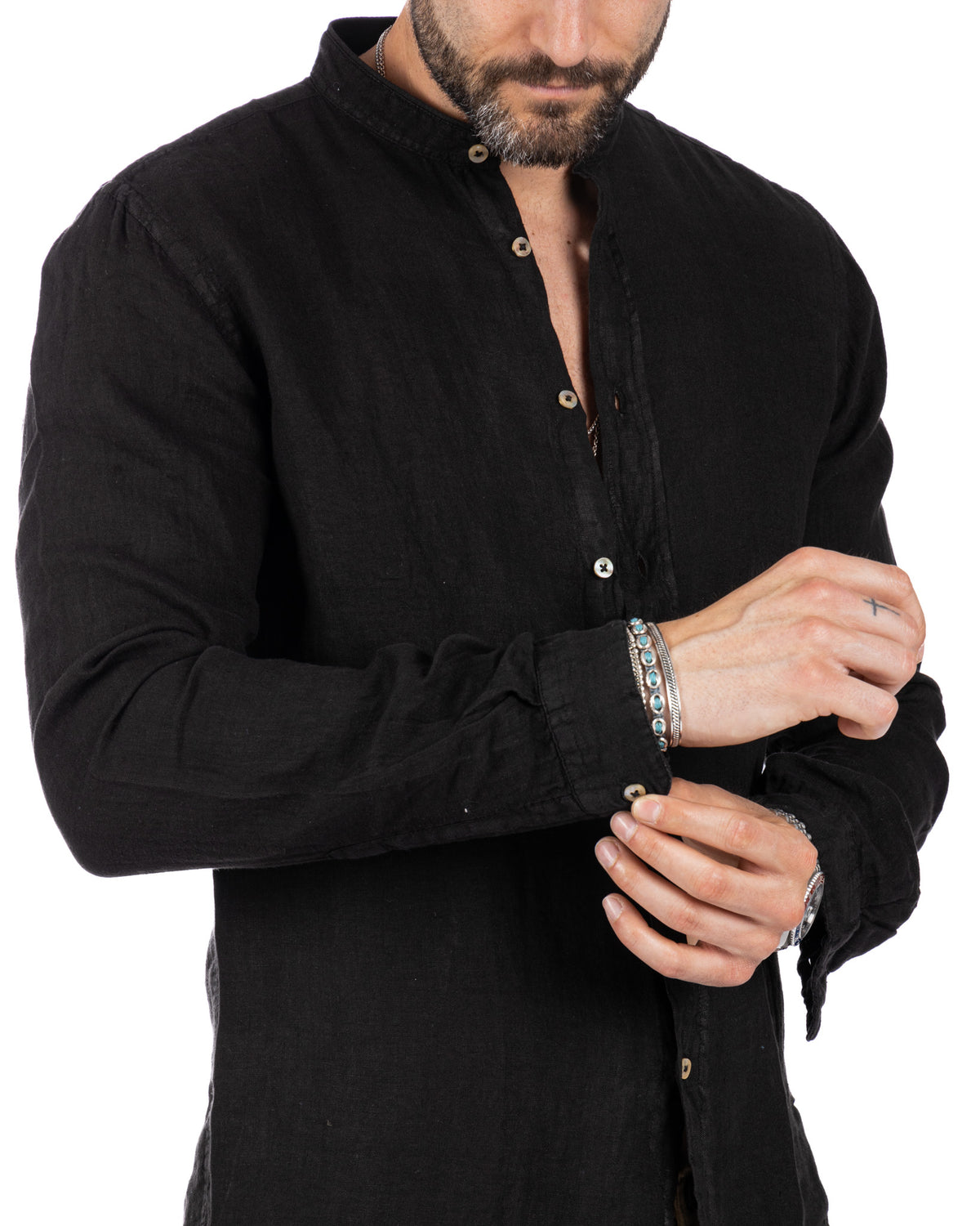 Black linen long-sleeve button-up shirt with mandarin collar, relaxed fit, and natural shell buttons.