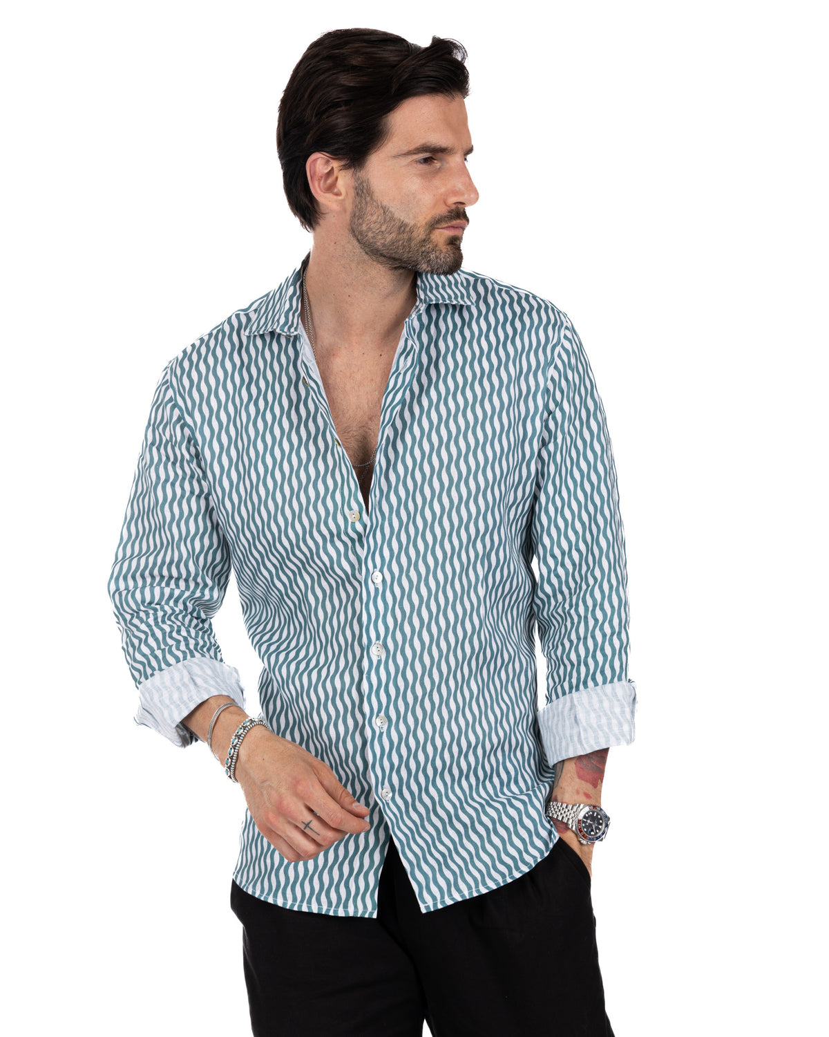 Men's slim-fit teal and white wavy striped linen button-down shirt with rolled sleeves and spread collar.