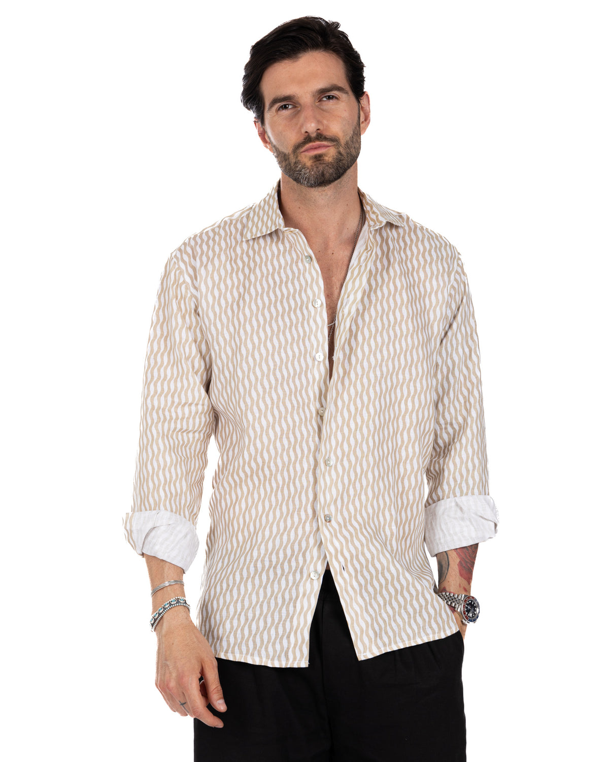 Men's beige and white wavy striped linen button-down shirt with rolled sleeves, relaxed fit, casual style.