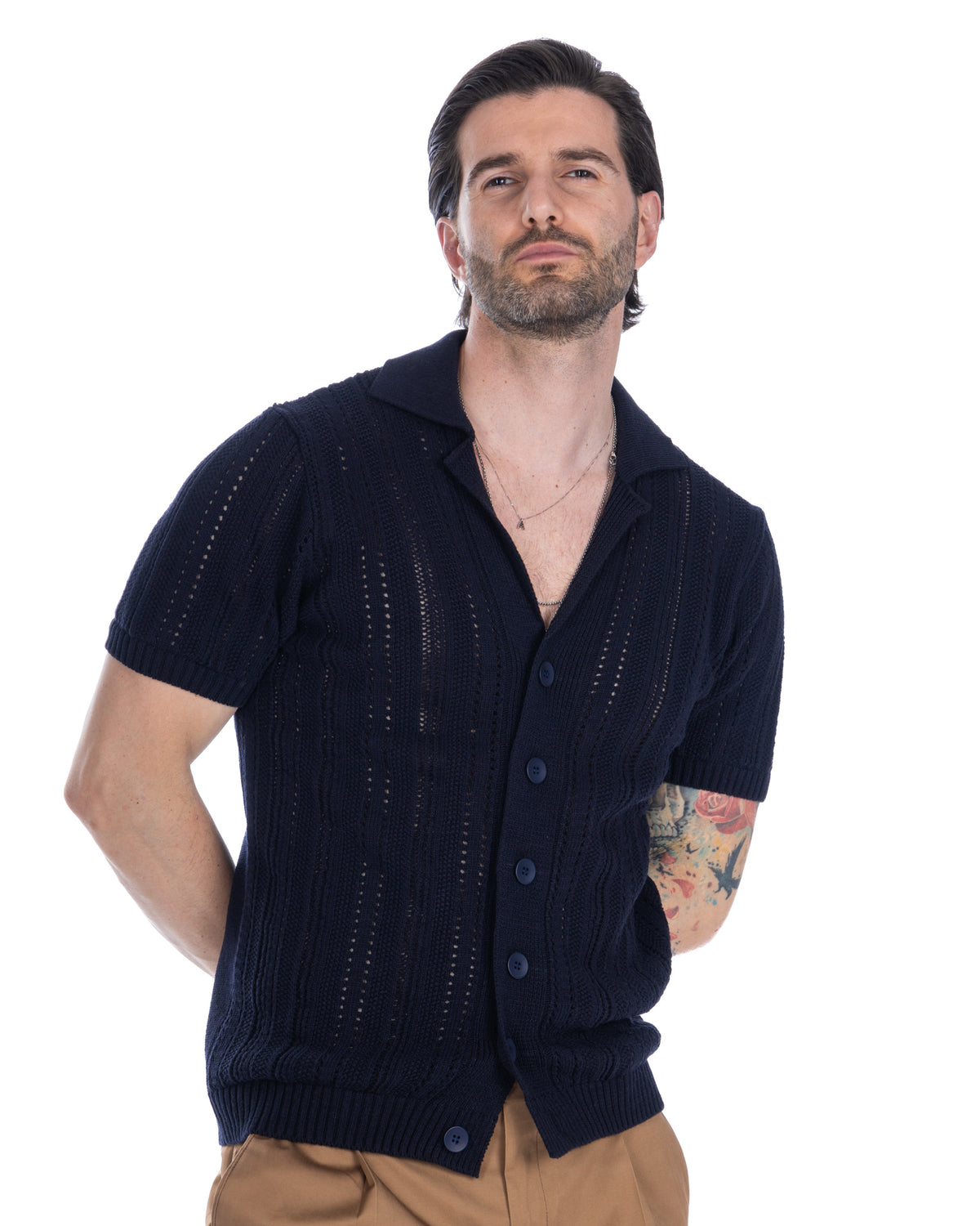 Navy blue short sleeve knit cardigan with cable pattern, button front, and openwork details. Men's cotton blend shirt.