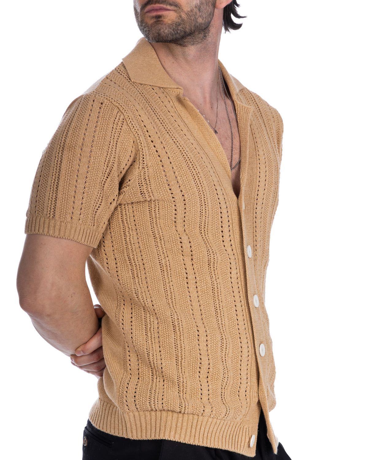 Beige short sleeve knit cardigan with cable stitch pattern, polo collar, and white buttons. Lightweight cotton blend.