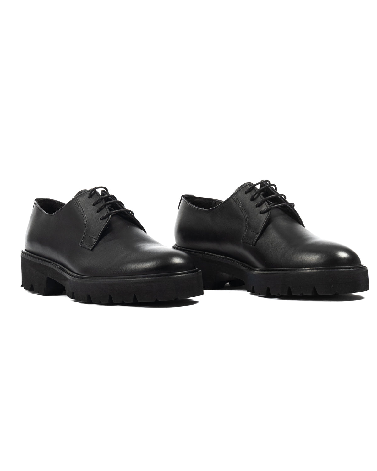 Black leather lace-up platform oxfords with chunky lug sole, sleek derby shoe design, minimalist formal footwear