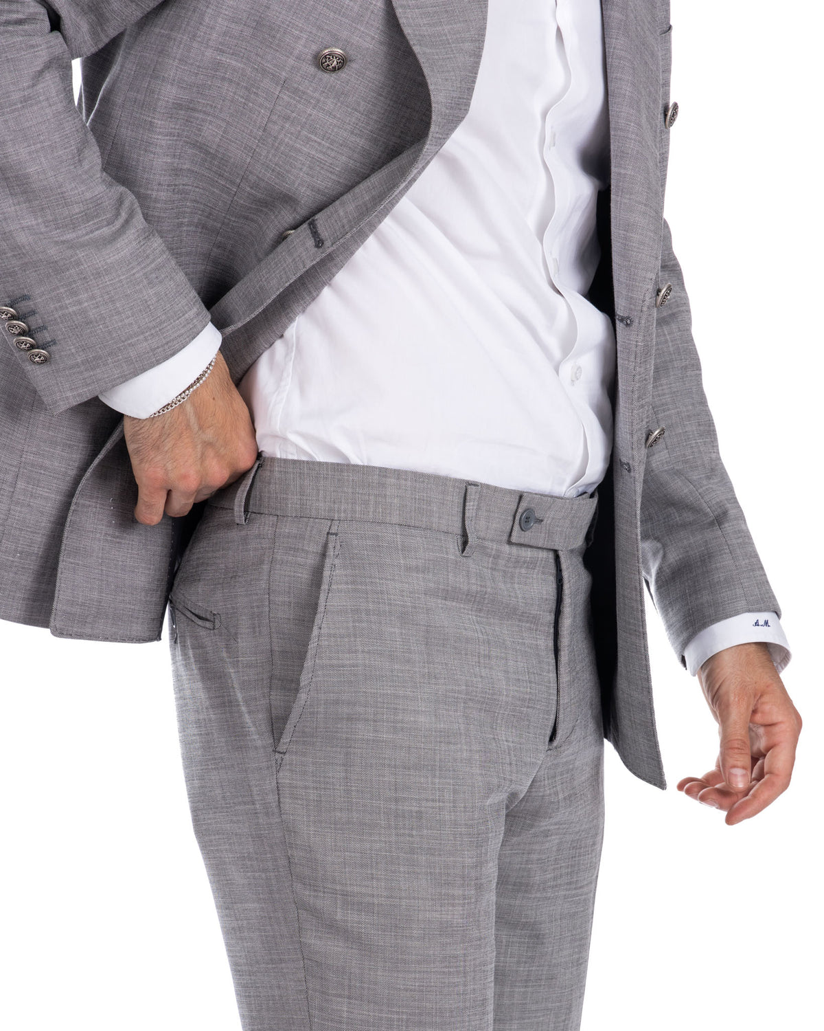 Light gray slim fit wool suit with white dress shirt, single-breasted jacket, and tailored trousers for men.