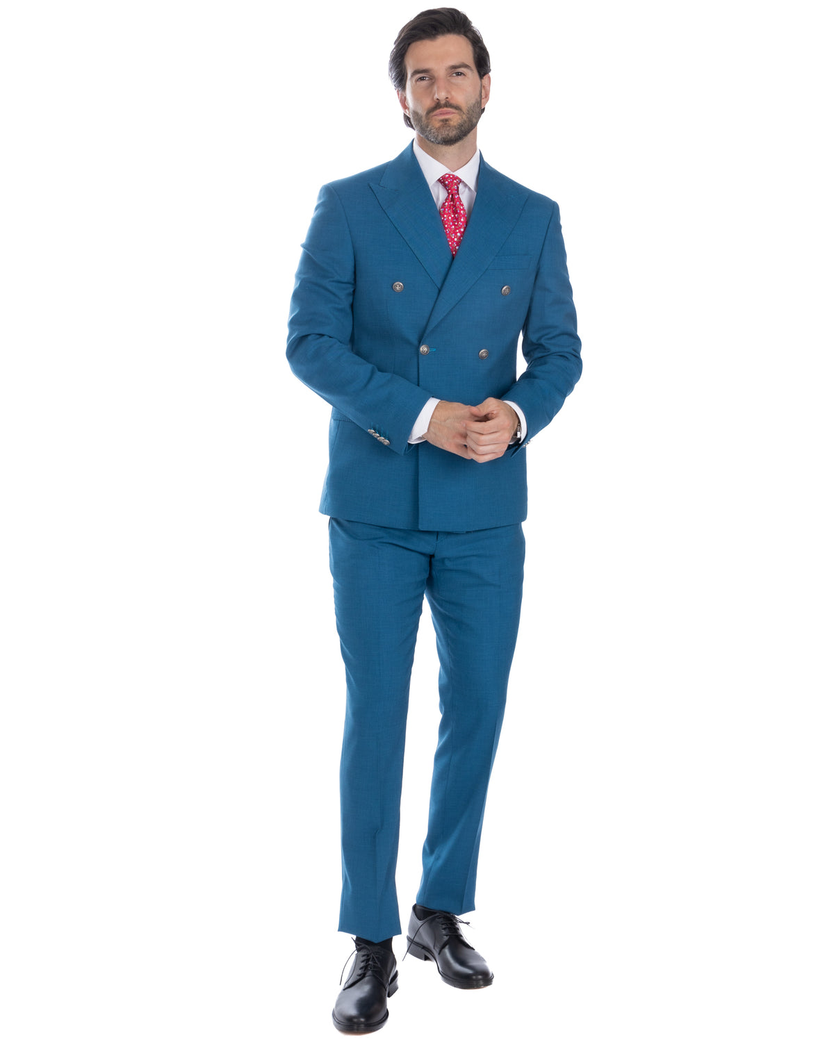 Teal blue double-breasted wool suit with red patterned tie, white dress shirt, and black leather oxford shoes.