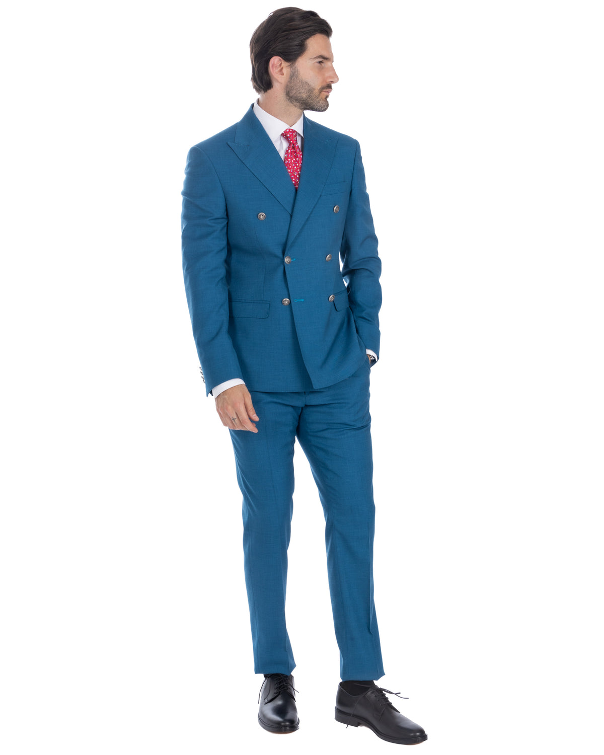 Teal blue double-breasted wool suit with silver buttons, white dress shirt, red patterned tie, and black leather oxford shoes