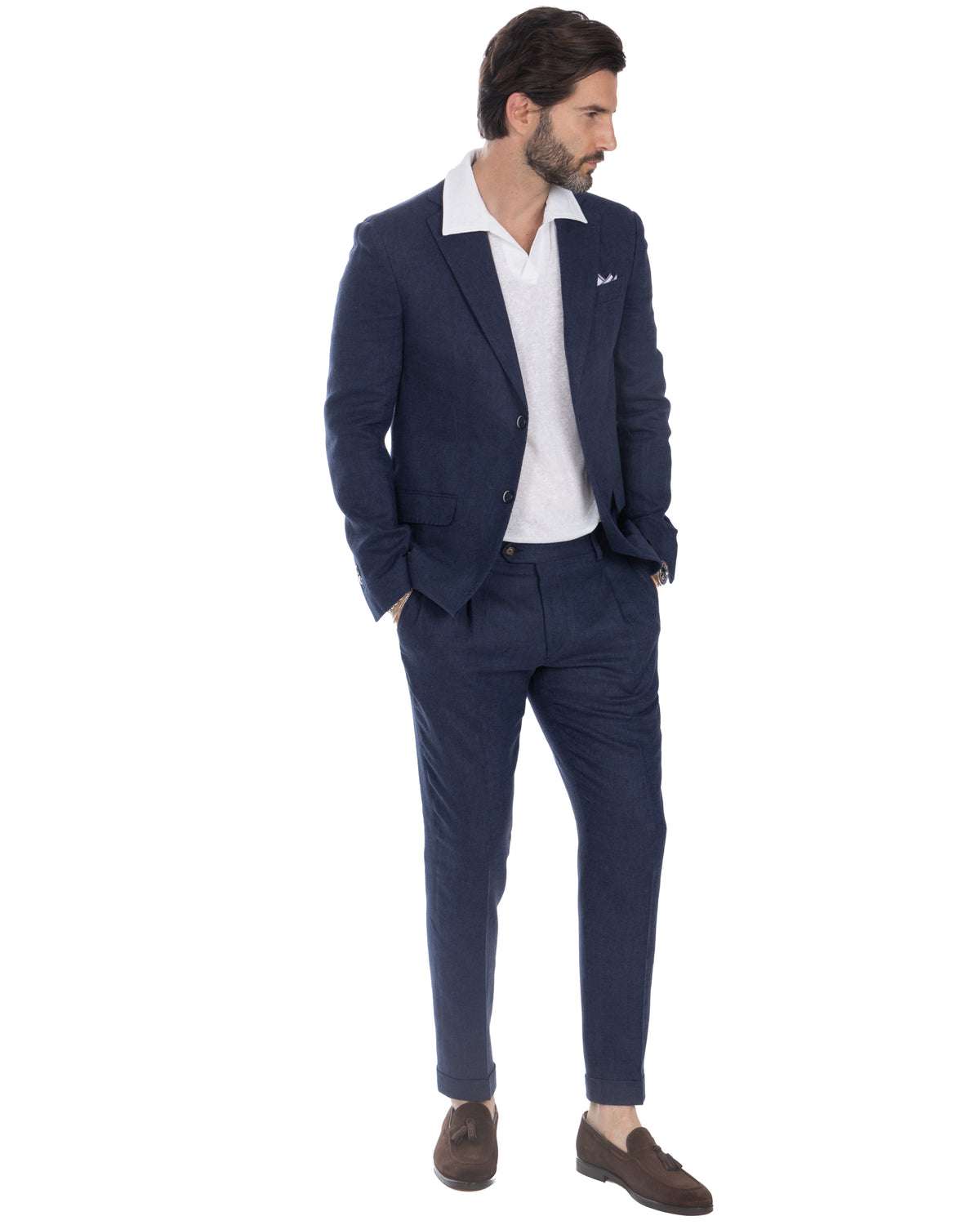 Navy blue linen suit with white polo shirt and brown suede loafers, smart casual menswear style.