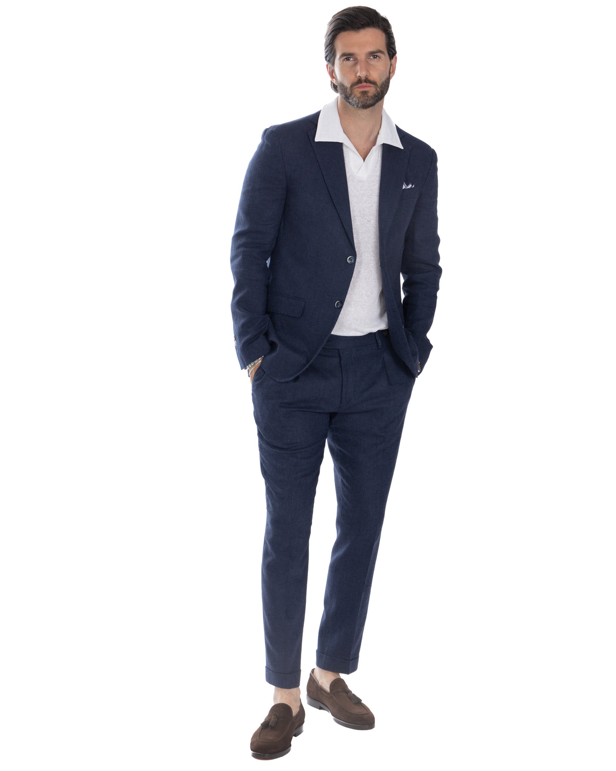 Navy blue linen suit with white polo shirt and brown suede loafers, smart casual menswear style.