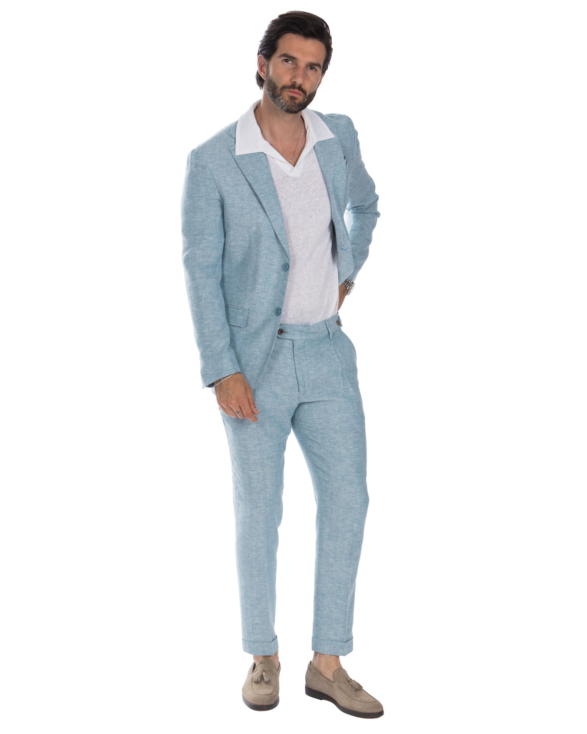 Light blue linen suit with white polo shirt and tan suede loafers, men's summer formal wear.