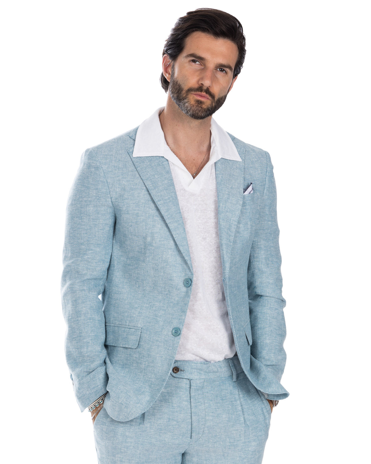 Light blue herringbone linen suit with white polo shirt, tailored fit, two-button blazer and matching trousers for men
