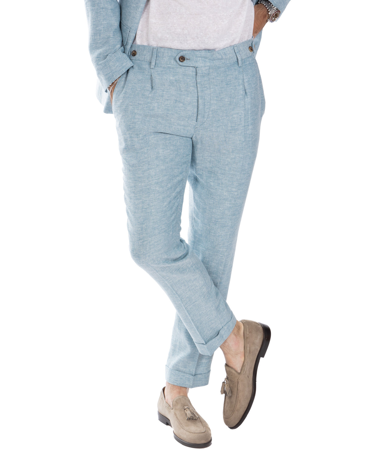 Light blue herringbone wool suit pants with pleated front, cuffed hem, and side adjusters.
