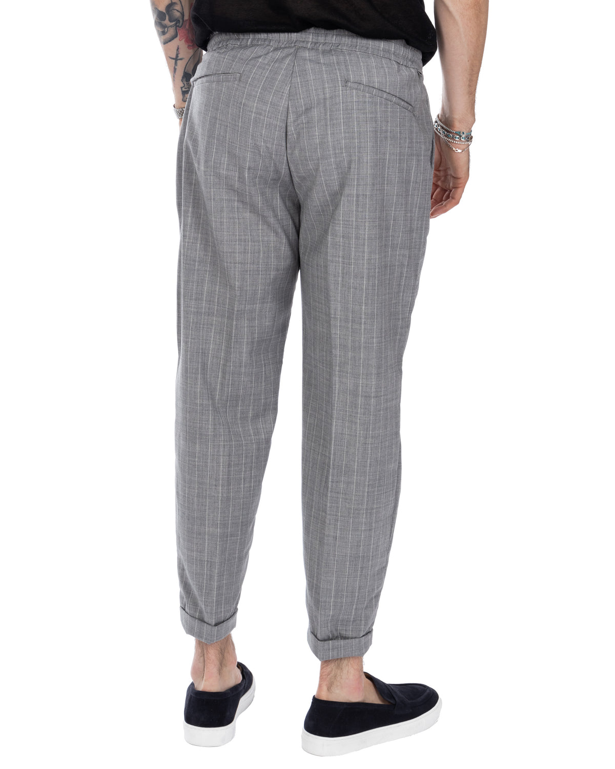 Men's gray pinstripe relaxed fit trousers with elastic waist, cuffed hems and back pockets. Casual tailored style.